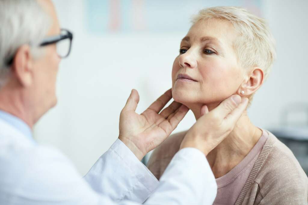 Examining patients thyroid