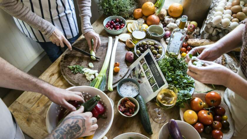 People cooking healthy food in the kitchen