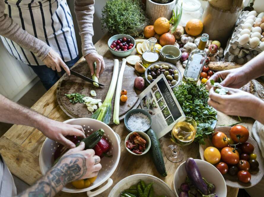 People cooking healthy food in the kitchen